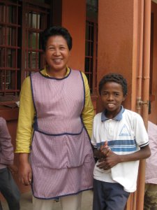 A teacher poses at the center for street kids run by the Church of the Nazarene in Antananarivo, Madagscar. Children receive basic education, a hot meal, and learn about the love of Jesus 